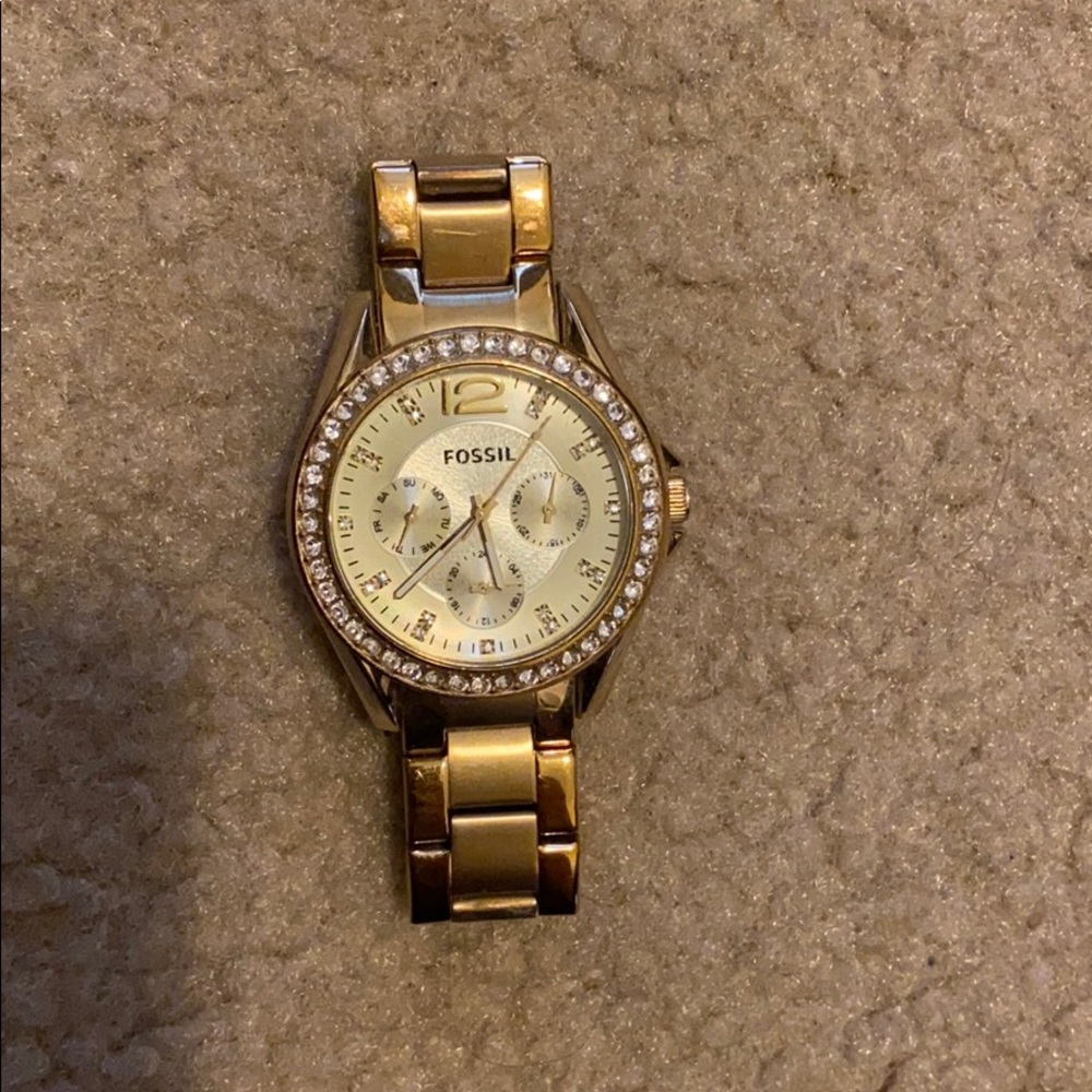 Gold Fossil watch with rhinestone accents